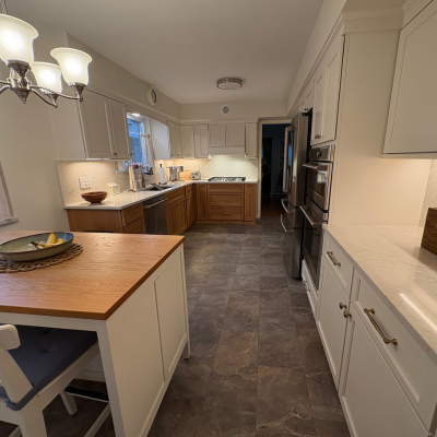 Tile flooring in a kitchen with wooden cabinets